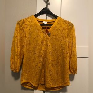 Fun yellow/orange half sleeve shirt, cool designs